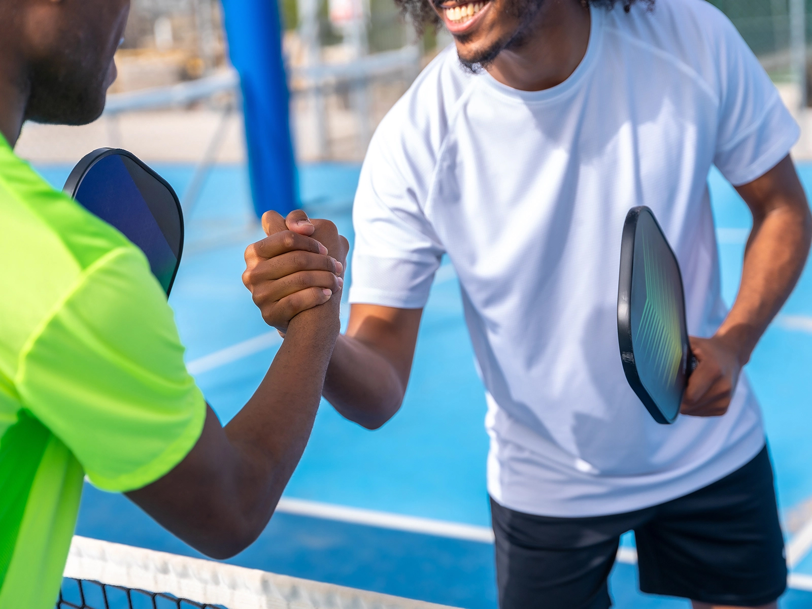 picleball players at net after match