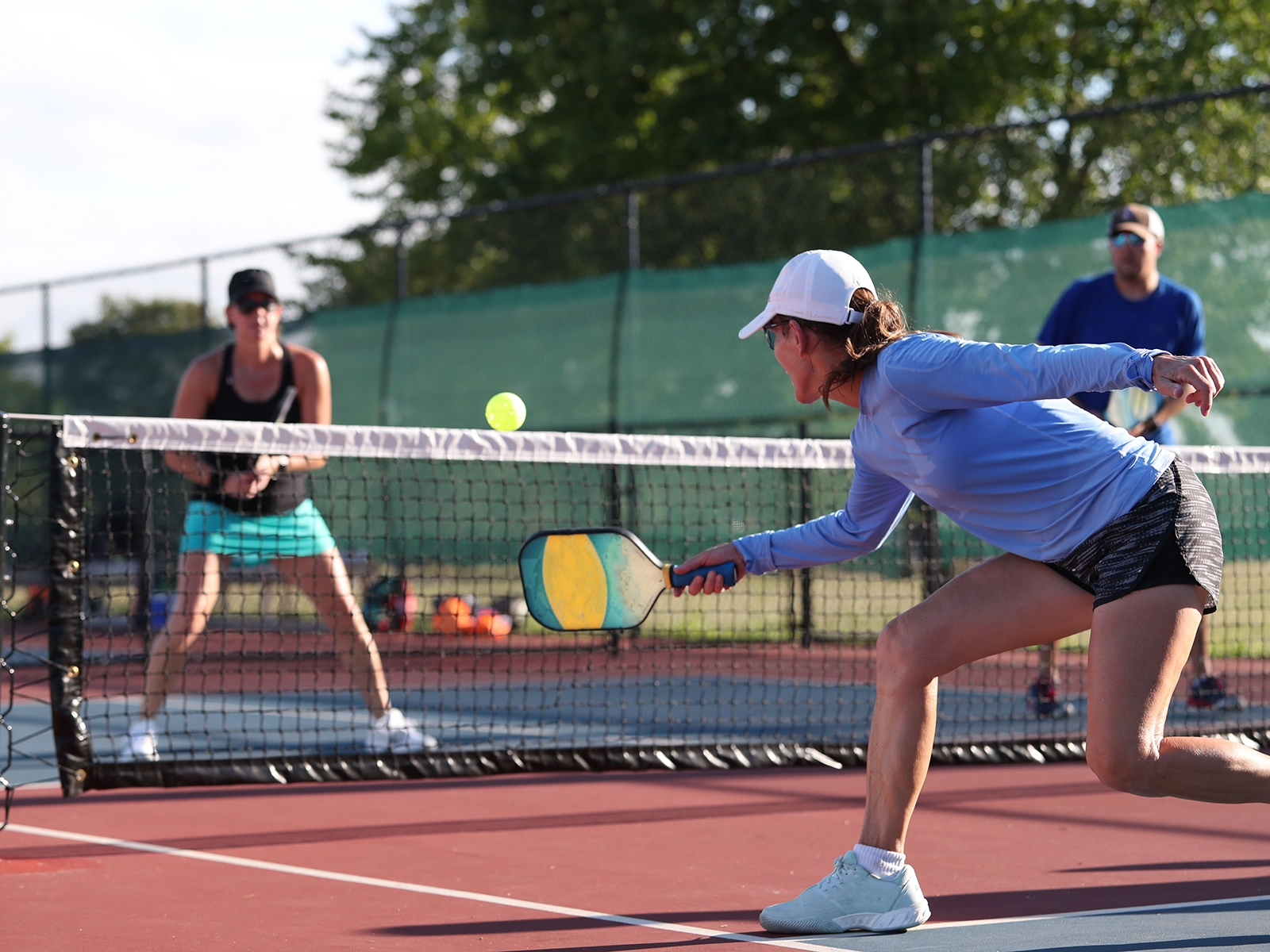 pickleball players at net