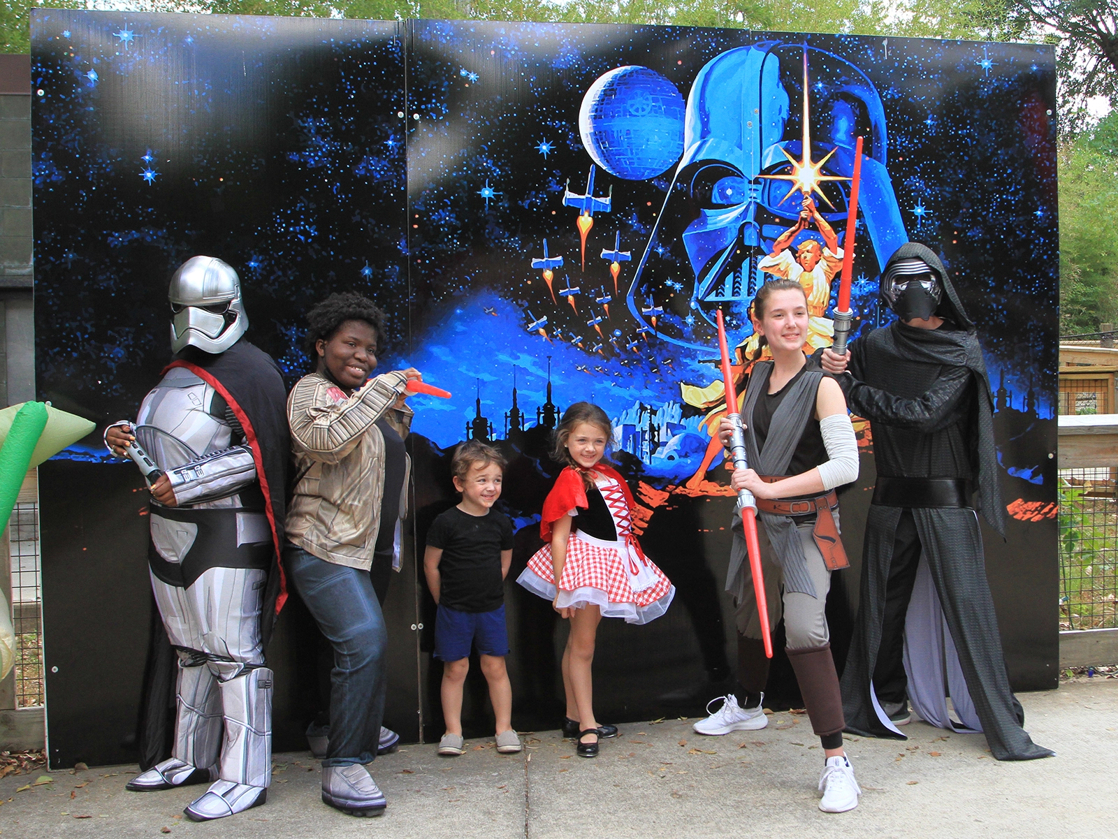 characters posing with kids