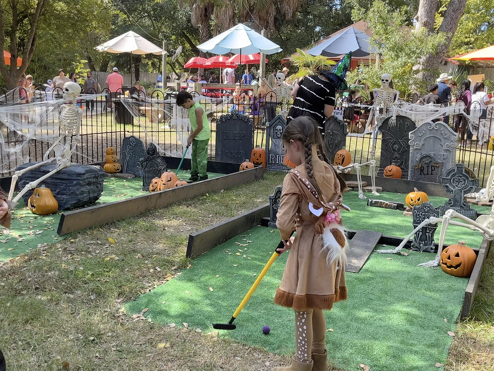 kids playing mini golf