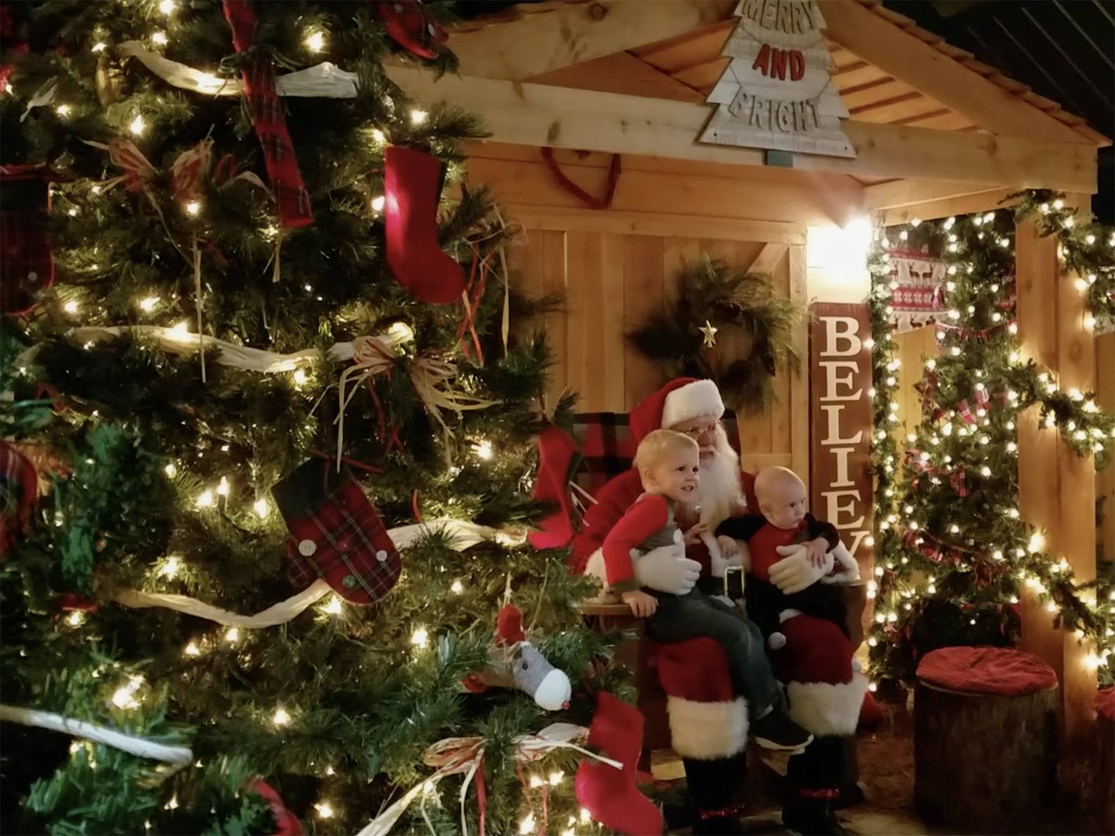 Santa sitting with kids